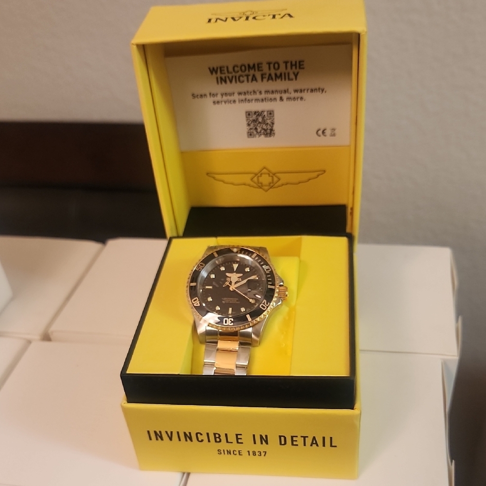 Invicta Gold and Silver Watch with Black Dial